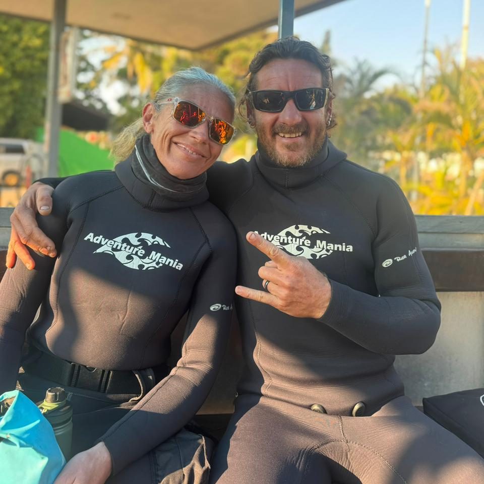 Ocean Torchbearer Award Winner Amanda Van Jaarsveld with Jacques van Jaarsveld in their wetsuits and sunglasses